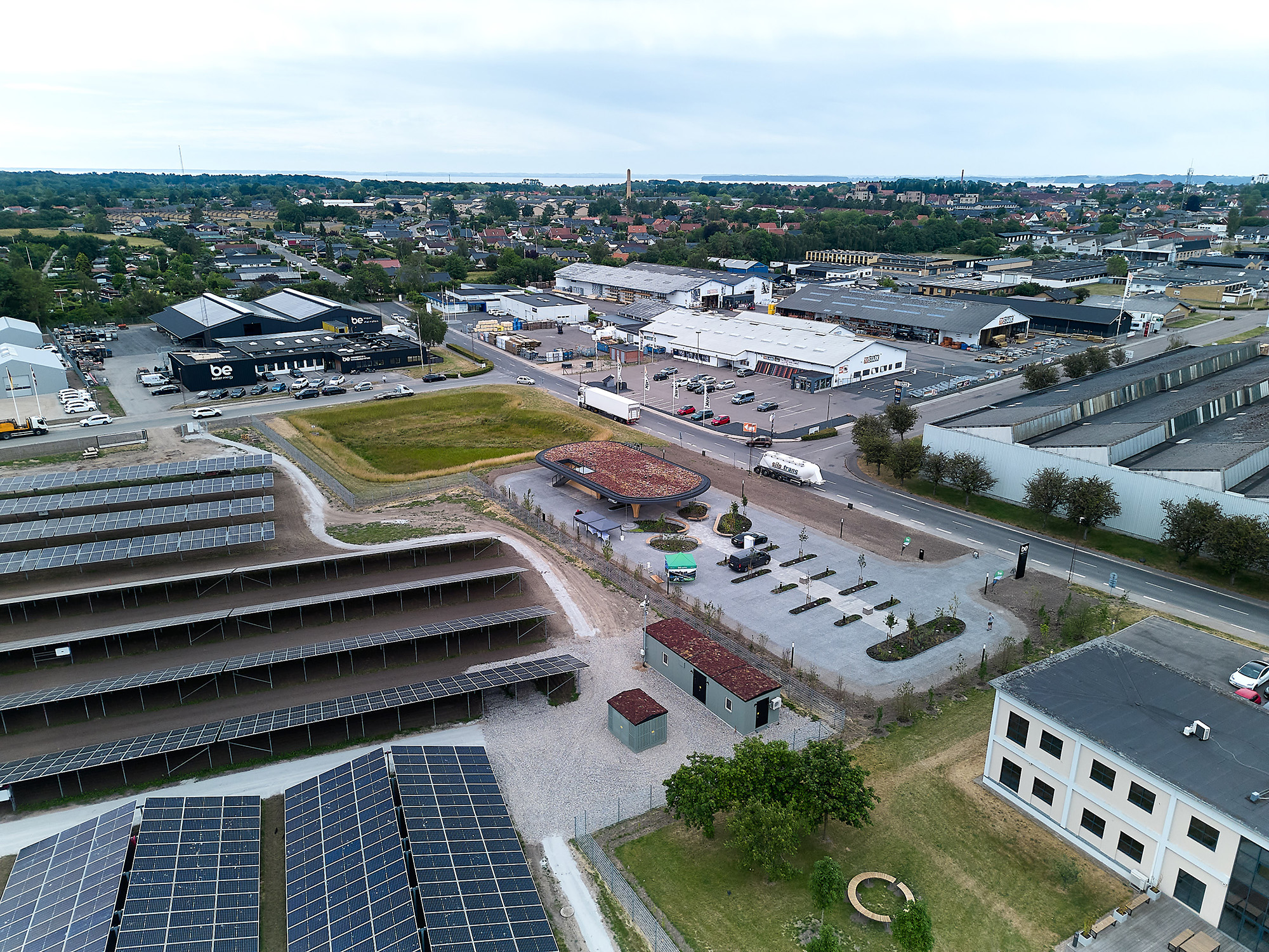 Drone shot of office building and solar park)